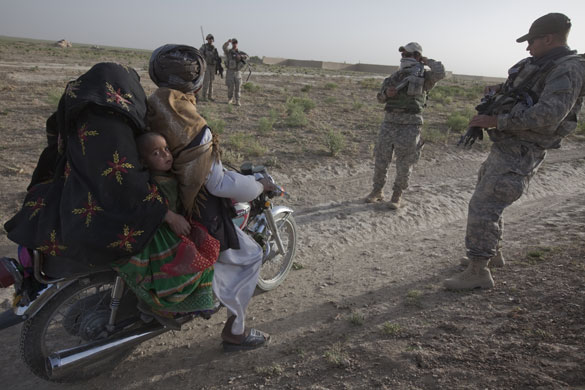 Sean Smith in Afghanistan: American soldiers from Charlie Company stop a passing bike