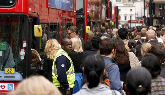 Tube strike: Victoria station: Commuters try to board a bus