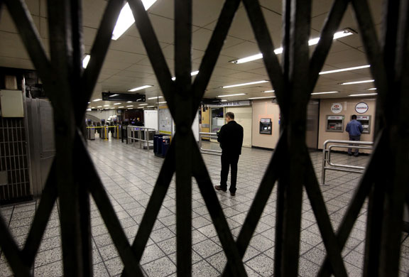 Tube strike: A man reads a notice informing commuters of the tube strike