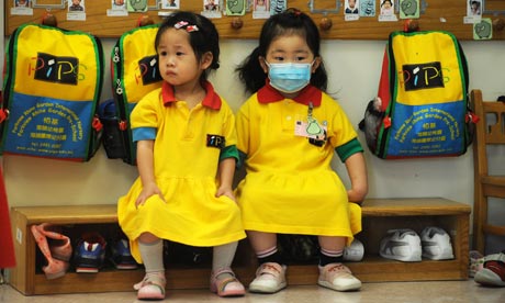 A girl wearing a mask at a kindergarten in Hong Kong