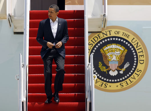 Week in Business: President Barack Obama walks down the stairs from Air Force One 