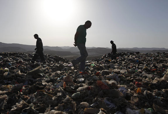 24 hours: Efeh, Israel: Garbage men search for a mattress