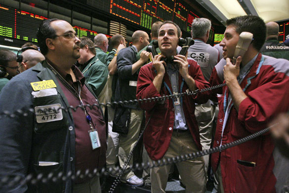 Week in Business: Traders work the crude oil options pit at the New York Mercantile Exchange