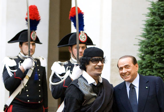 Gaddafi in Rome: Gaddafi smiles with Berlusconi outside Chigi Palace