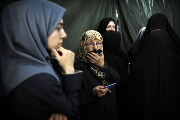 Iranian elections: Women line up to vote in a mosque transformed into a polling station