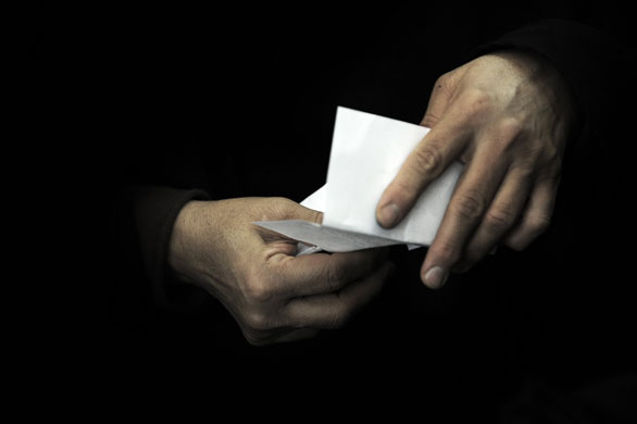 Iranian elections: A woman holds her ballot