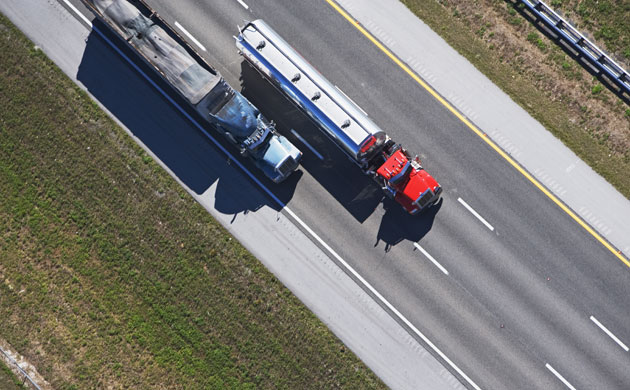 megatrucks: aerial view of trucks on highway