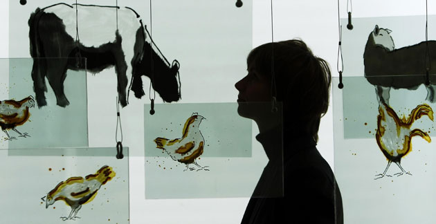 12 June 2009: Edinburgh, UK: A woman looks at a work by Emma McGarvie