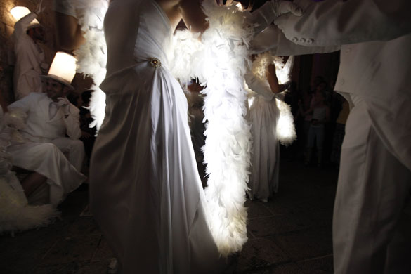 12 June 2009: Jerusalem, Israel: Actors in illuminated outfits dance outside Jaffa