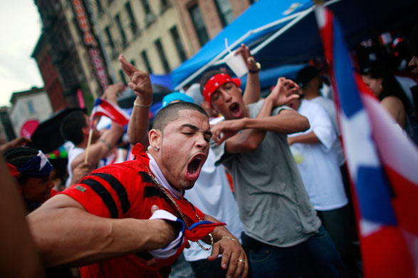 24 hours: New York, US: Revelers at the Street Festival in Spanish Harlem