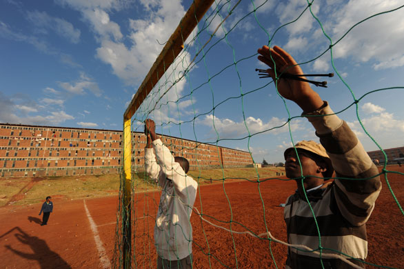 24 hours: Johannesburg, South Africa: Men set up a football goal