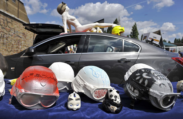 Art Car Boot Fair: Embellished helmets on sale at a stall