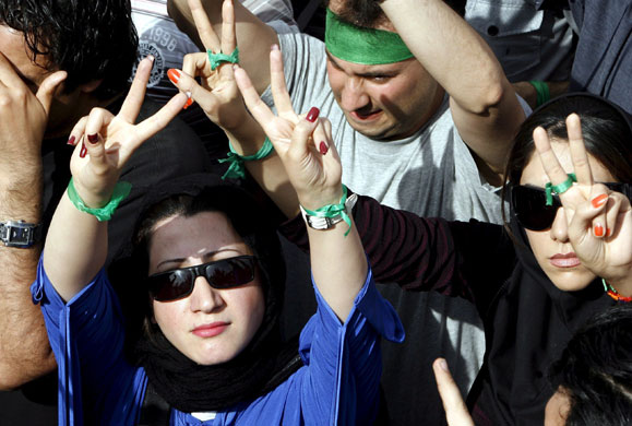 Tehran protest: Supporters of Mousavi flash the victory sign