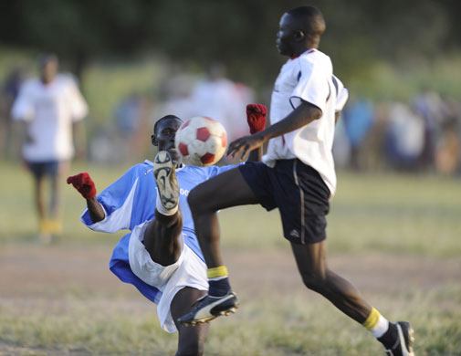 Katine football: Dokolo Tigers captain Oumo Amos tackles the Katine Actors Sam Osage