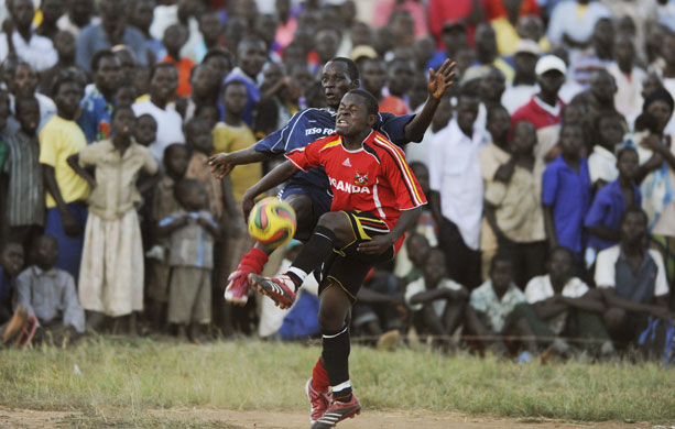 Katine football: Uganda Cranes Hamis Kizza (R) and Teso Eleven player