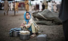 A child rests after collecting food rations at the Chota Lahore relief camp in Pakistan