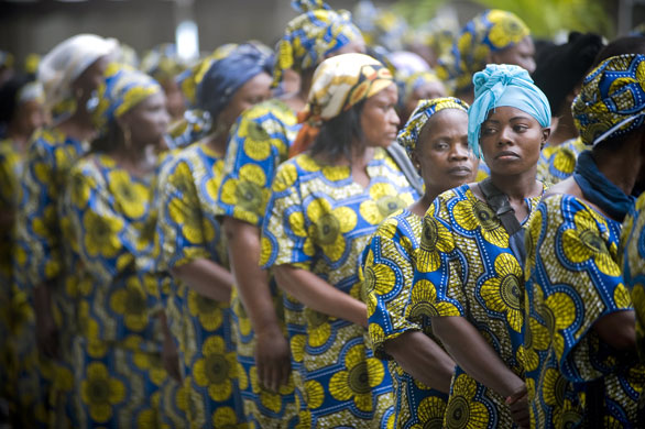 24 hours: Libreville, Gabon: Women wait to pay tribute to Omar Bongo