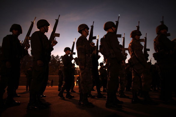 24 hours: Mexico City, Mexico: Soldiers prepare to board military vehicles