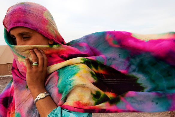 24 hours: Jalozai Camp, Pakistan: A displaced woman battles in severe winds
