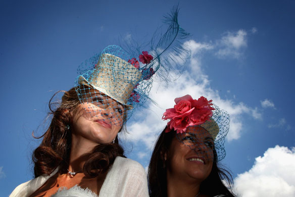 First day at Ascot: Ladies in hats pose for photographs