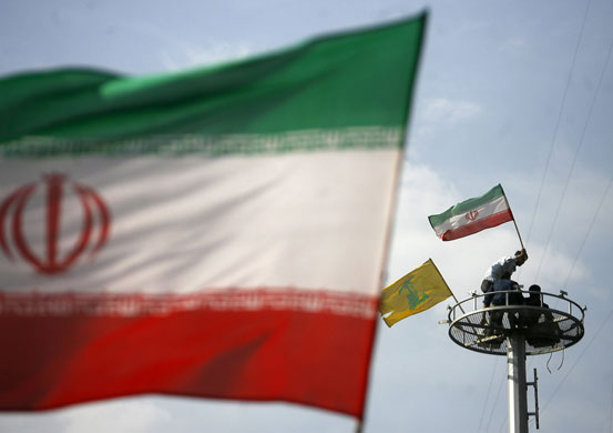 Iranian protests: Supporters of Ahmadinejad wave national flags