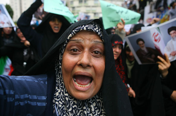 Iranian protests: A woman attends a state-organized rally in a square in central Tehran