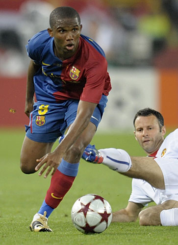 Utd transfer oldies: Samuel Eto'o skips past the sliding tackle of Ryan Giggs 