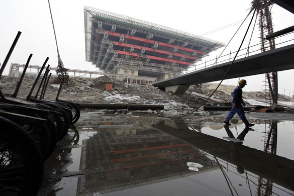 Week in Business: A migrant labourer at the Shanghai 2010 Expo site, China.