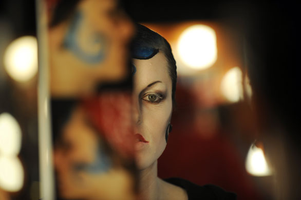 24 hours in pictures: Artist checks make up before the Cirque Berzek's show in Los Angeles