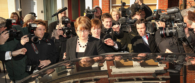 Jacqui Smith: 2009: British Home Secretary Jacqui Smith is surrounded by reporters