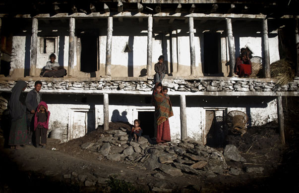 24 hours in pictures: Nepalese villagers pose in the village of Sawa Khola