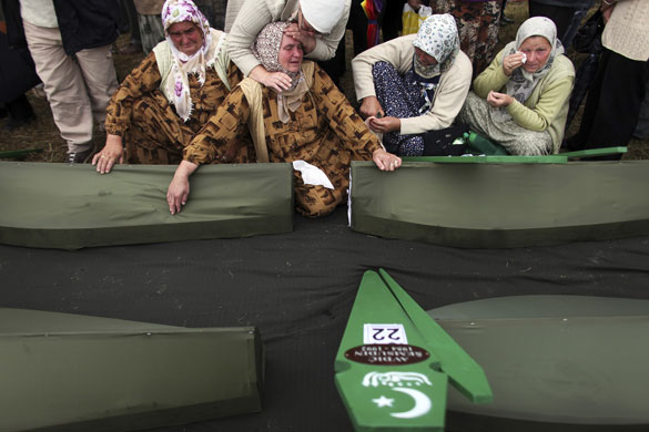 24 hours in pictures: Bosnian Muslim cries over coffins mass funeral Zvornik