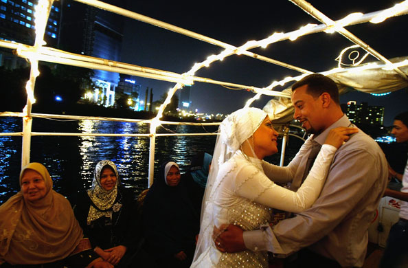 24 hours in pictures: Egyptian groom dances with his bride in Cairo
