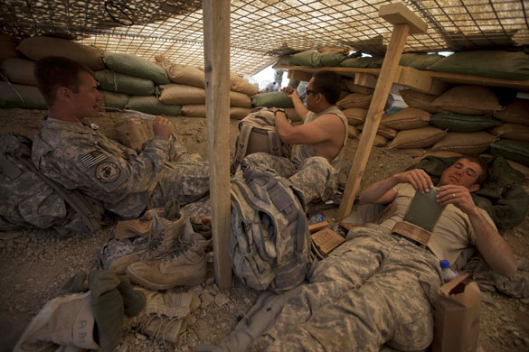 Sean Smith Afghanistan: Soldiers from Blackfoot Company eat lunch at an observation post 