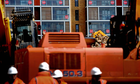 Builders at a development of new flats in Dalston, east London