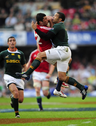 lions 1st test: Jamie Roberts is tackled by Bryan Habana