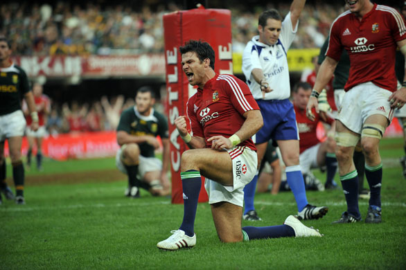 lions 1st test: Scrumhalf Mike Phillips celebrates after scoring the Lions' third try