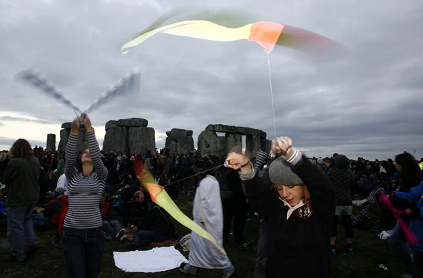 Stonehenge solstice: Revellers play poi at the summer solstice at Stonehenge