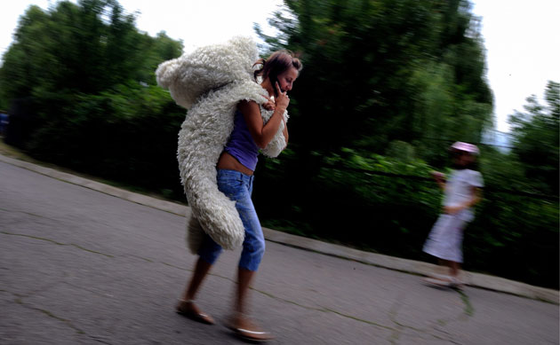 24 hours in pictures: Sofia, Bulgaria: A girl carries her teddy bear in Sofia's Zoo