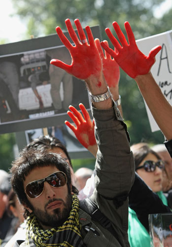 Protests about Iran: Berlin, Germany:  Demonstrators display their red-painted hands