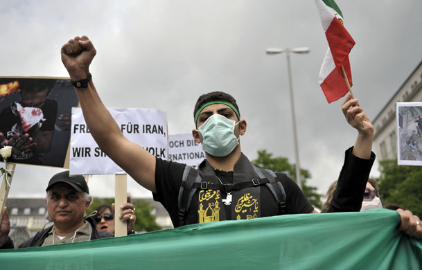 Protests about Iran: Hamburg, Germany: A man demonstrates against the Iranian election result 