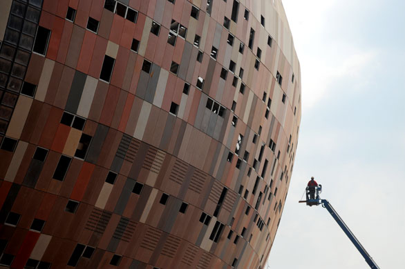 22 June 2009: : Soweto, South Africa: Workers at the under Soccer City stadium