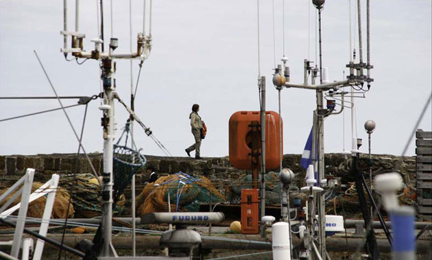 Colin Fenn: Woman on quay Pittenweem