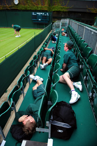 Style at Wimbledon: Ground staff take a break before the 2009 Wimbledon Championships