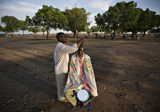 eyewitness: Man has his head shaved in an open field at Nasir in south Sudan
