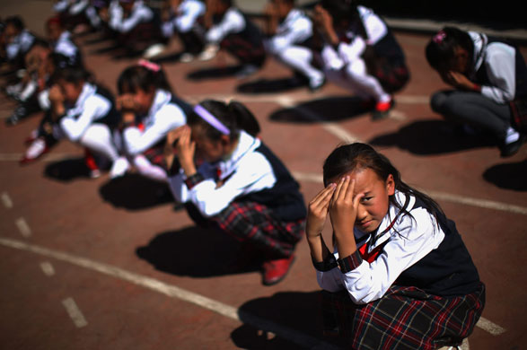 24 hours in pictures: Life in Lhasa Children do eye exercises in the playground