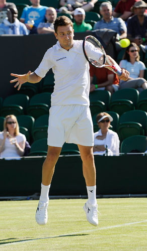 wimbledon: Alex Bogdanovic plays a backhand return