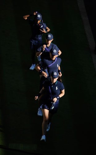 tom wimbledon: Ballboys run in to their positions on Centre Court