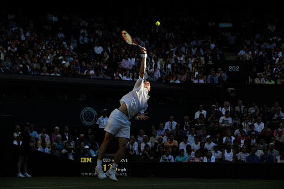 tom wimbledon: Andy Murray stretches during a serve