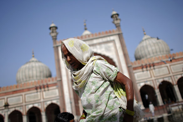 24 hours in pictures: ndian Muslim walks in front of the historic Jama Masjid mosque New Delhi